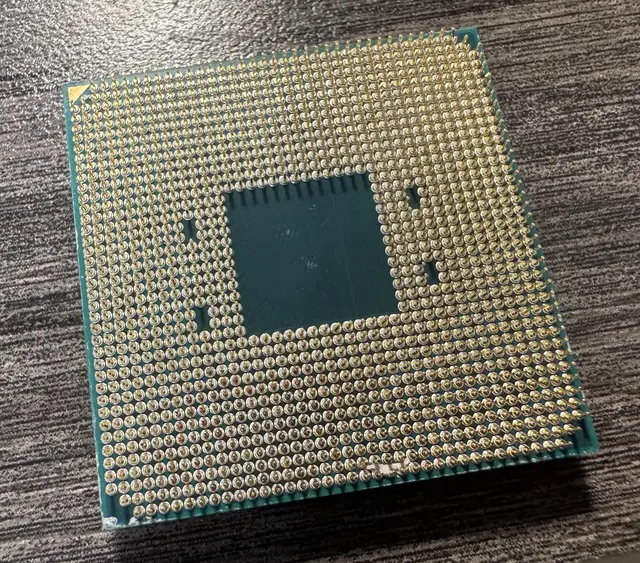 Pin side of the used 5700X showing debris between the pins